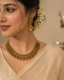 Antique Gold Finish Temple Necklace Set with Green Stones & Jhumka Earrings