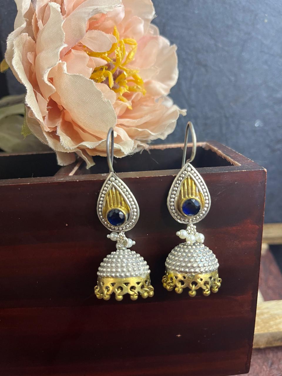 Dual tone blue stone studded jhumkha latkan earrings