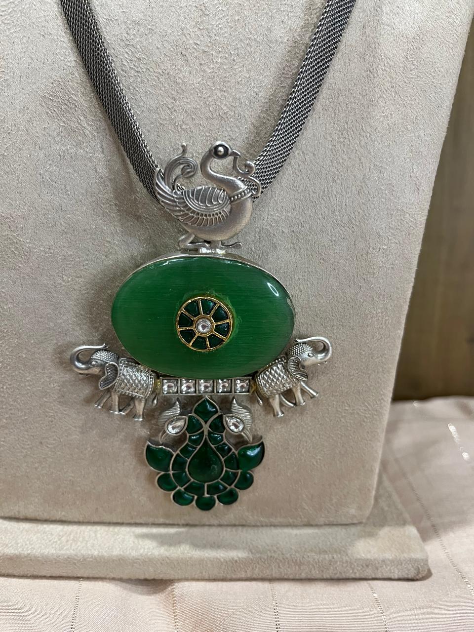 Silver replica stone studded pendant necklace with earrings