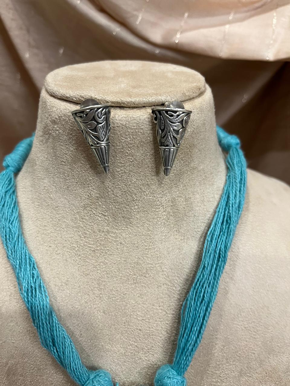 Silver replica pendant with cotton thread dori