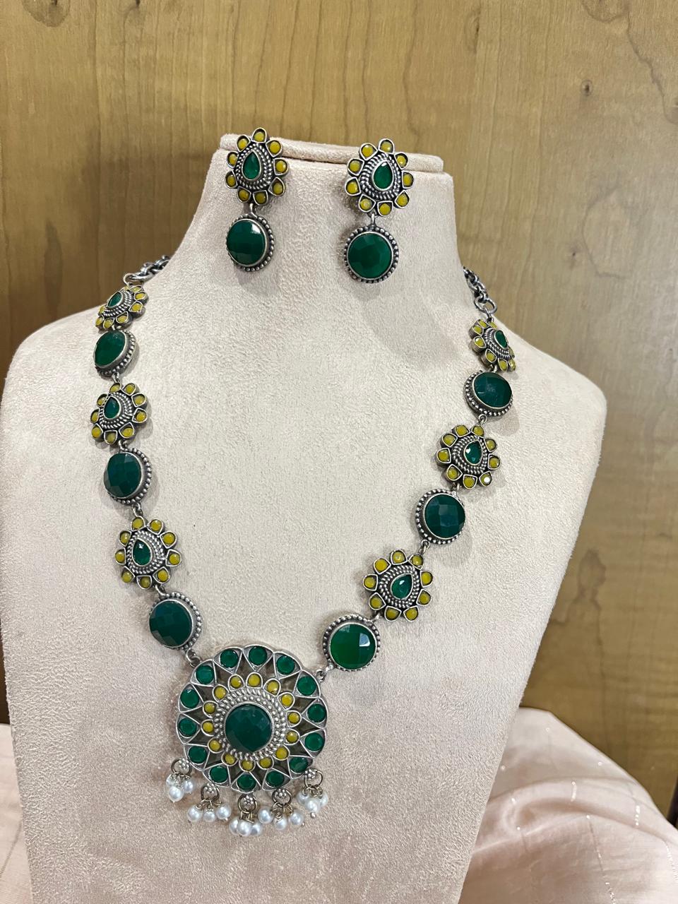 Silver replica stone studded necklace