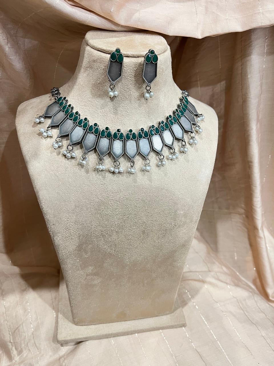 Silver replica ckoker set with green stone studded