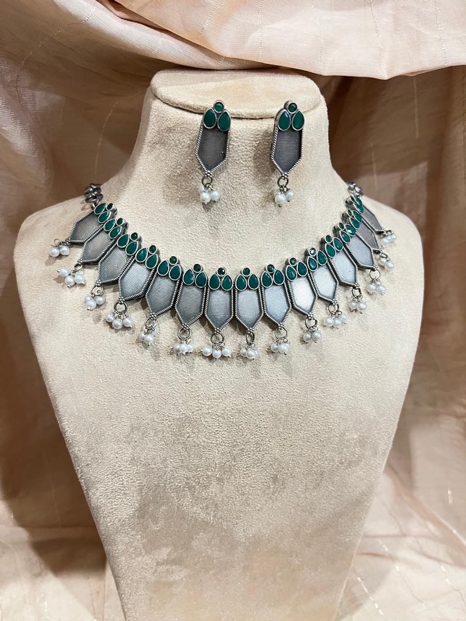 Silver replica ckoker set with green stone studded