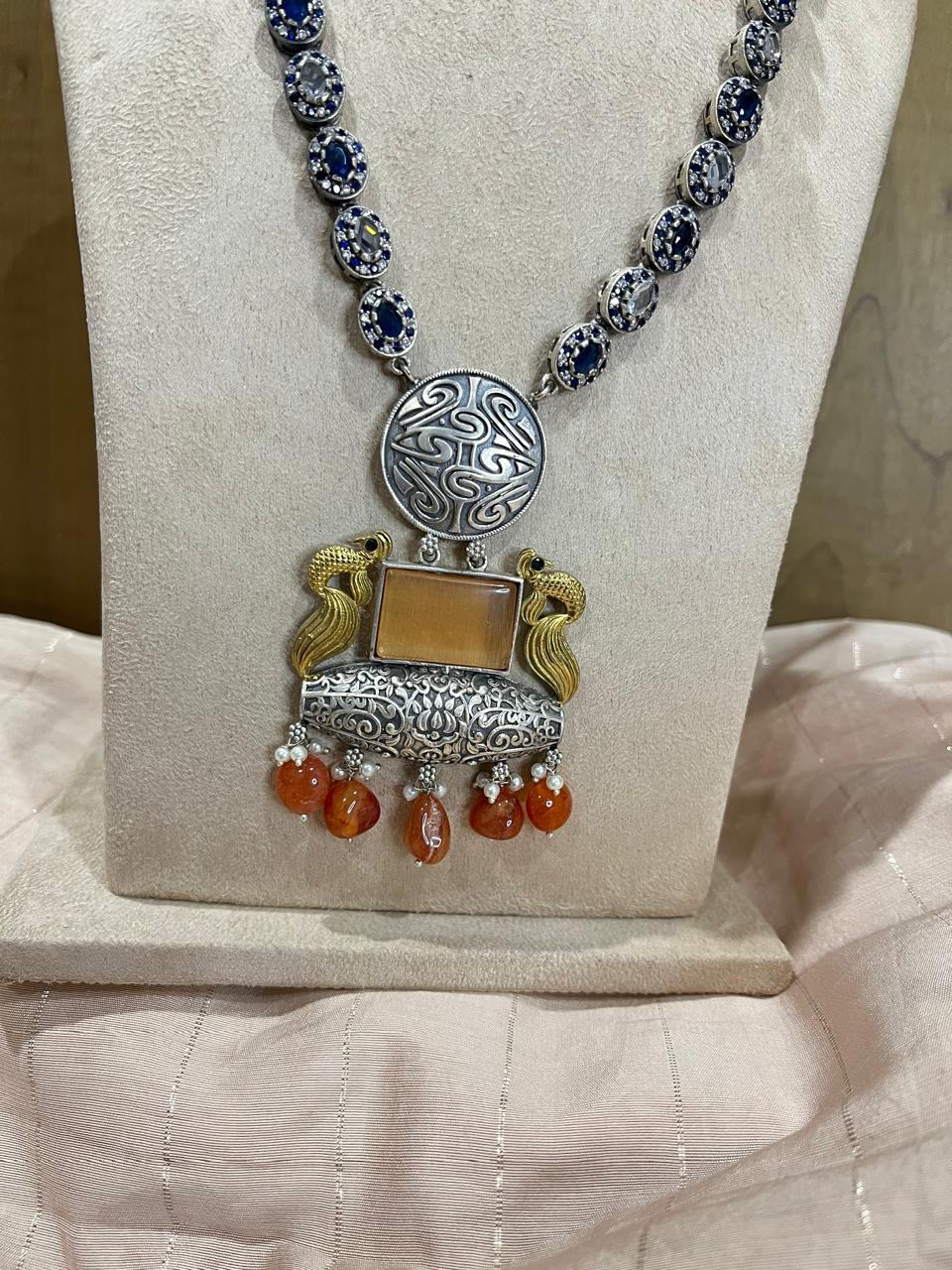 Dual tone stone studded long necklace with earrings