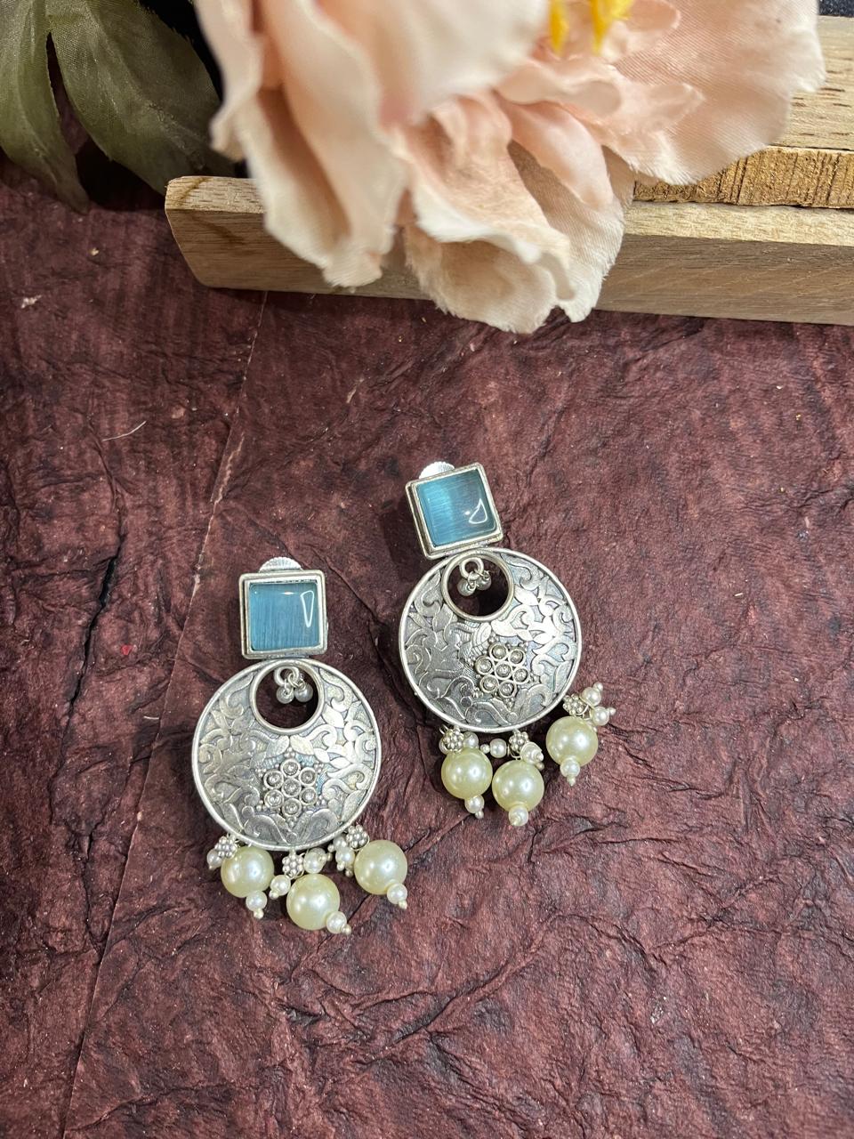 Silver replica stone studded earrings