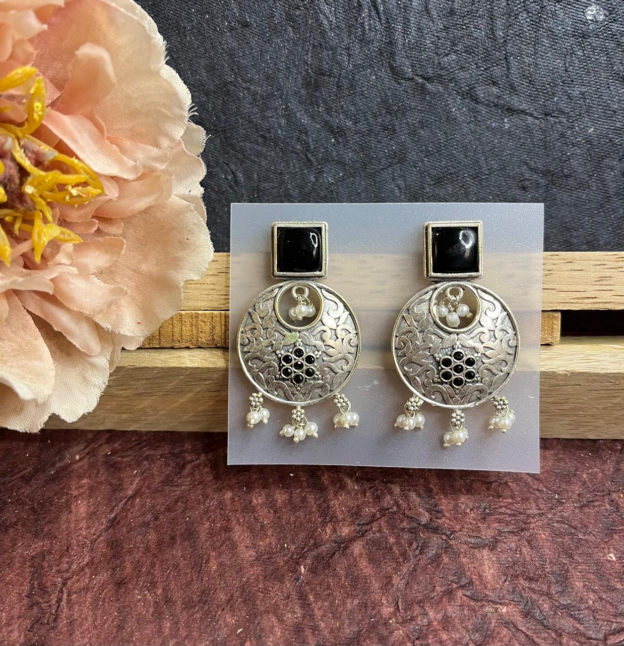Silver replica stone studded earrings