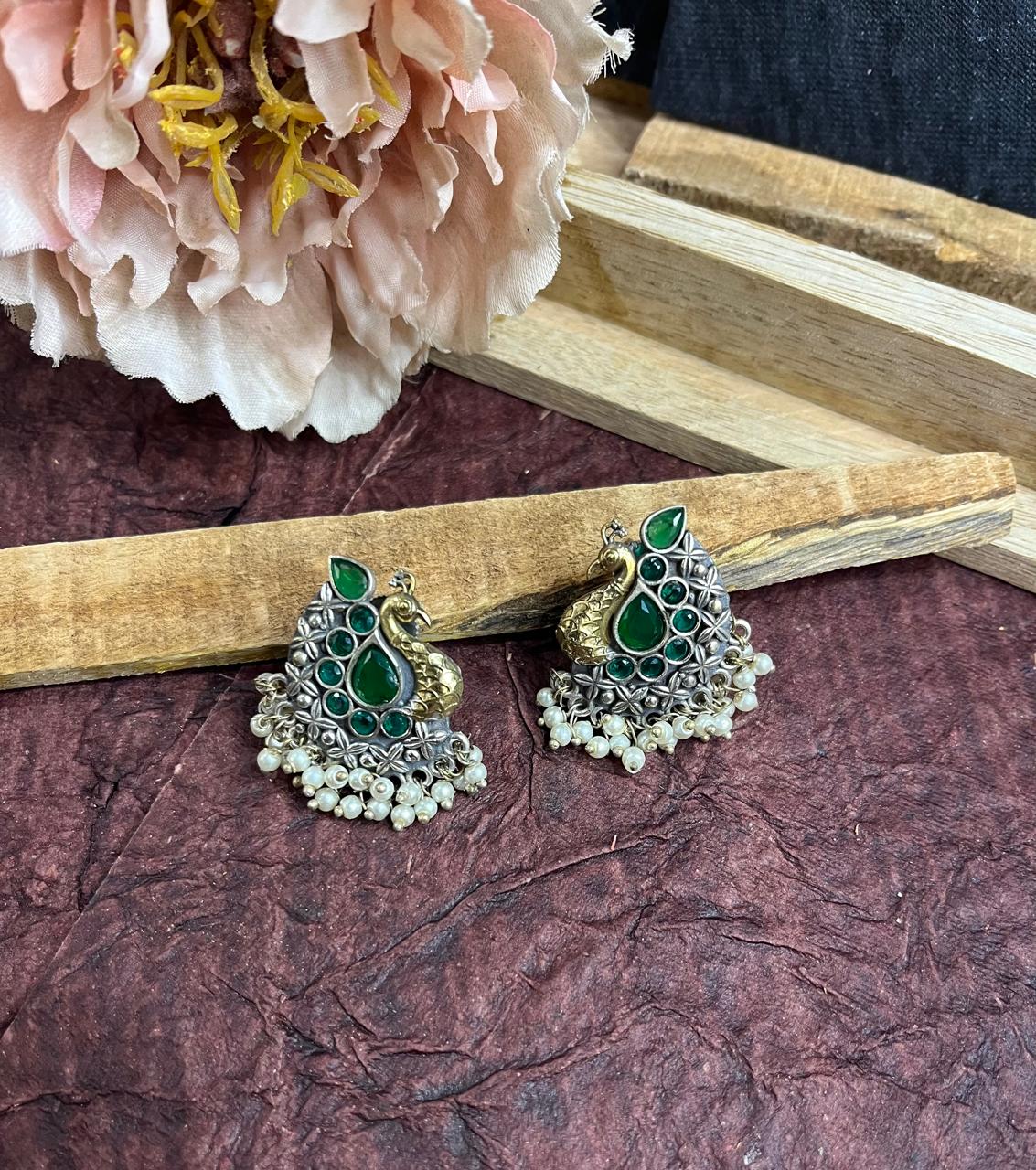 Green stone studded peacock studs