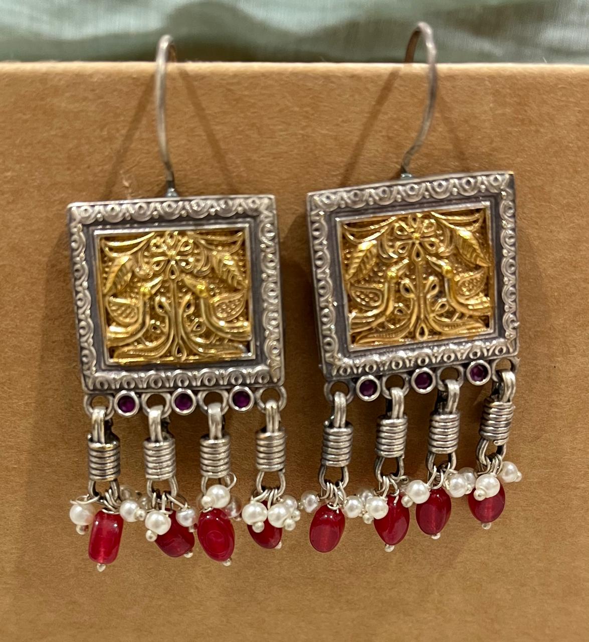 Dual tone hang earrings with beads