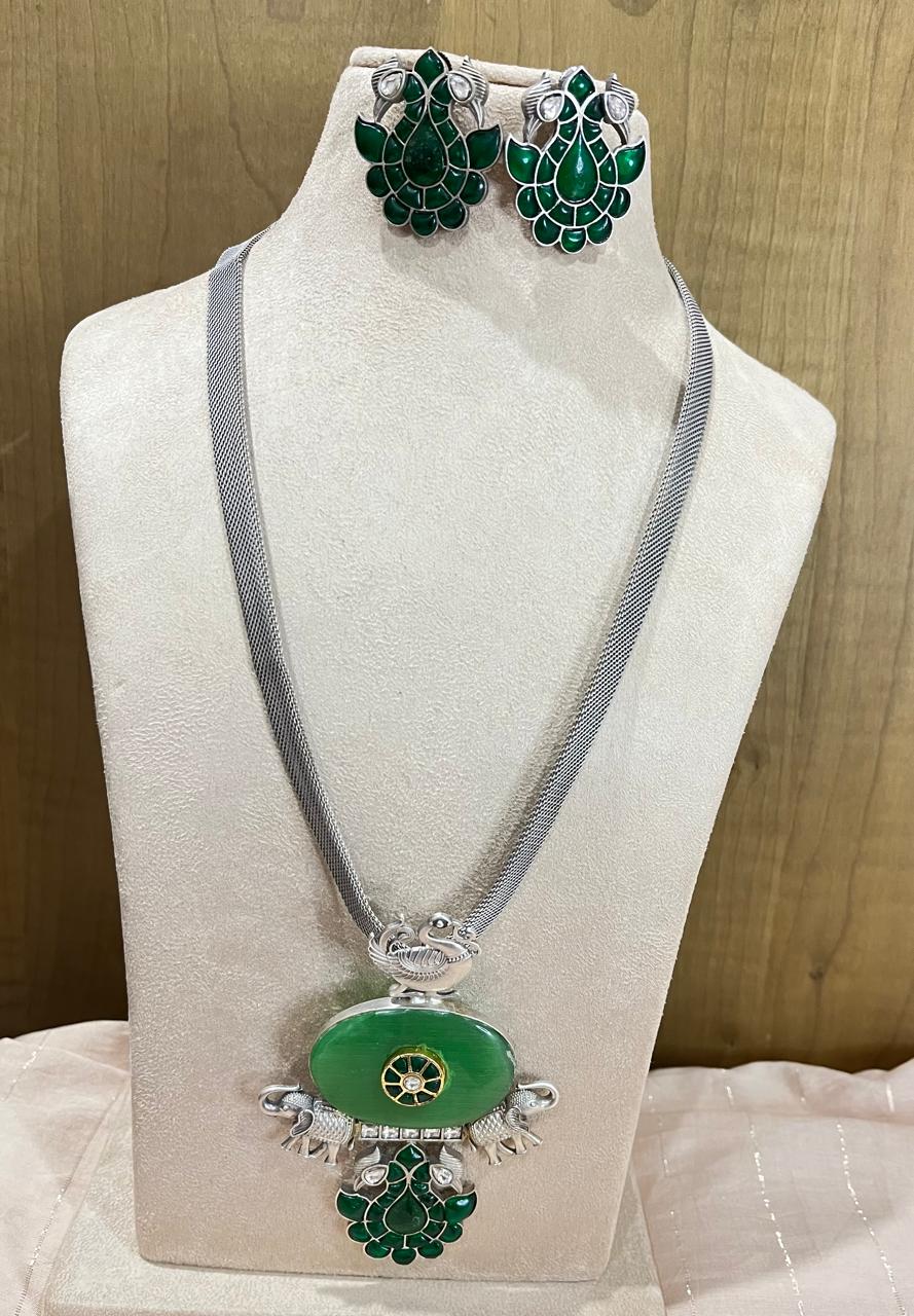 Silver replica stone studded pendant necklace with earrings